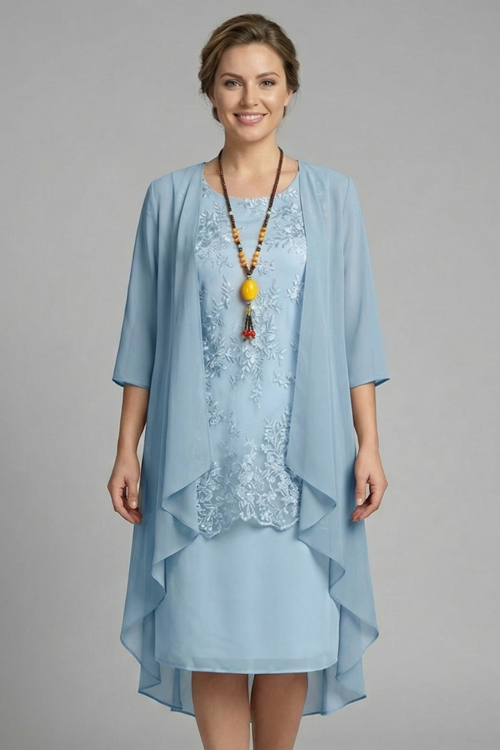 Lightweight women's layered dress with sheer overlay, round neck, short sleeves. Ideal knee-length spring/summer casual chic.