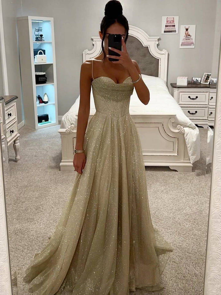 Elegant women's light pink maxi dress with long sleeves and open back, perfect for evening or formal events.