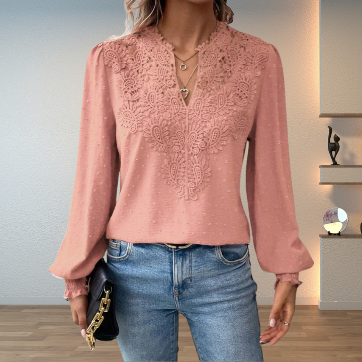 Women's elegant long sleeve blouse featuring delicate lace, a flattering v-neck, and a dotted pattern.