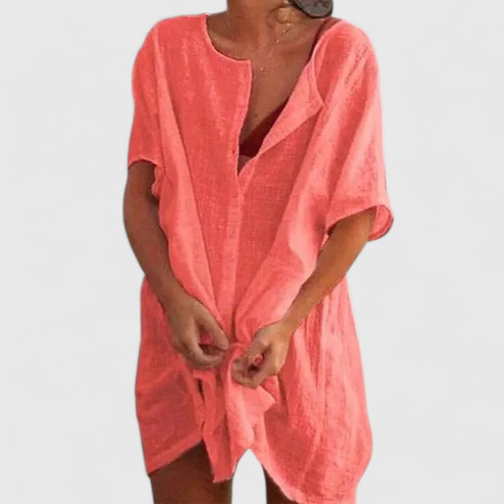 Lightweight fabric detail of an elegant women's summer tunic dress, soft and breathable.