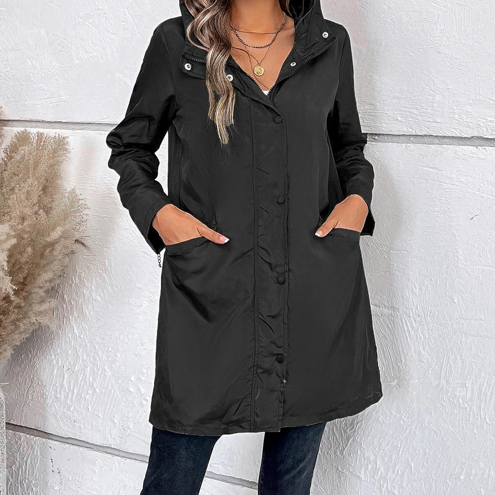 Elegant women's long autumn coat with a stylish high collar and button tab closure, perfect for fall fashion.