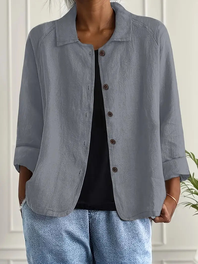 Women's elegant long sleeve button-up blouse with delicate buttons. Versatile collared shirt, perfect for workwear.