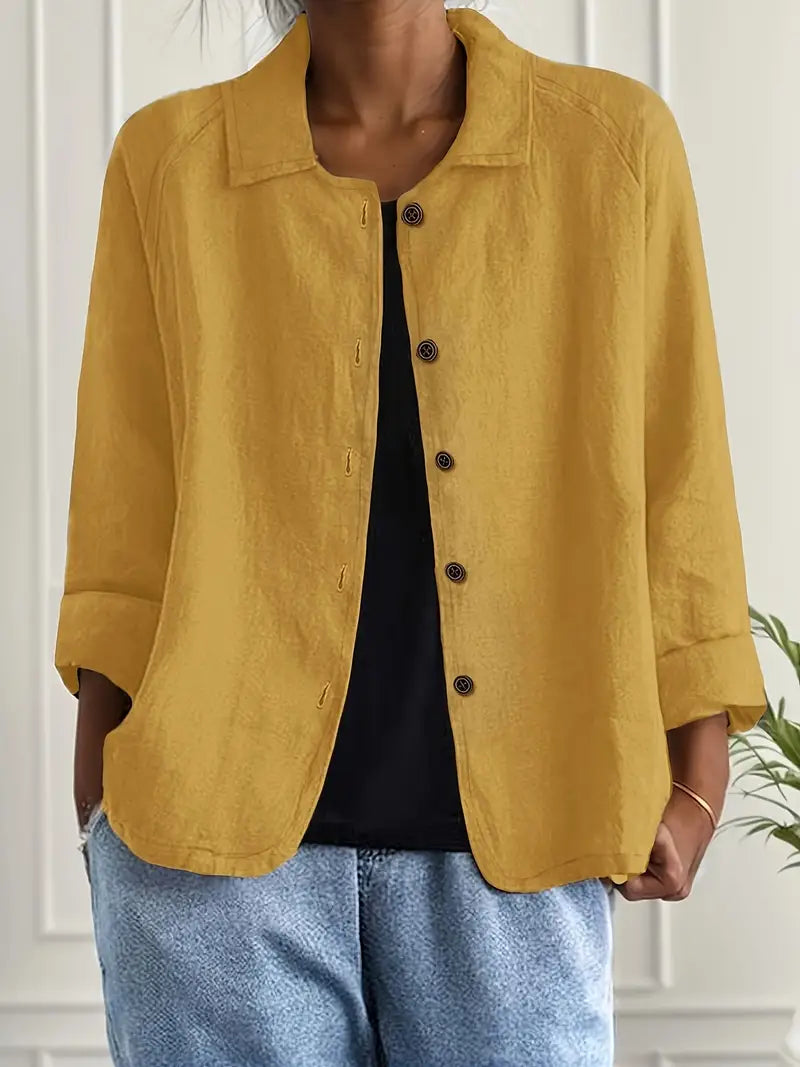 Front view of an elegant women's long sleeve button-up blouse with an open collar. A chic and versatile collared shirt.