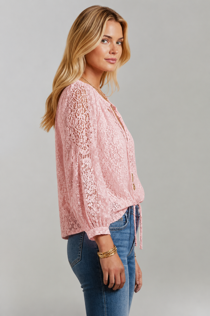 Sheer women's long sleeve lace blouse with an elegant tied neckline. Fashionable & comfortable.