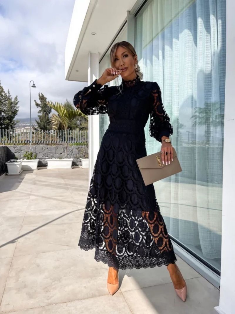 Formal women's midi dress featuring delicate lace & long sleeves, ideal for wedding guests & special occasions.