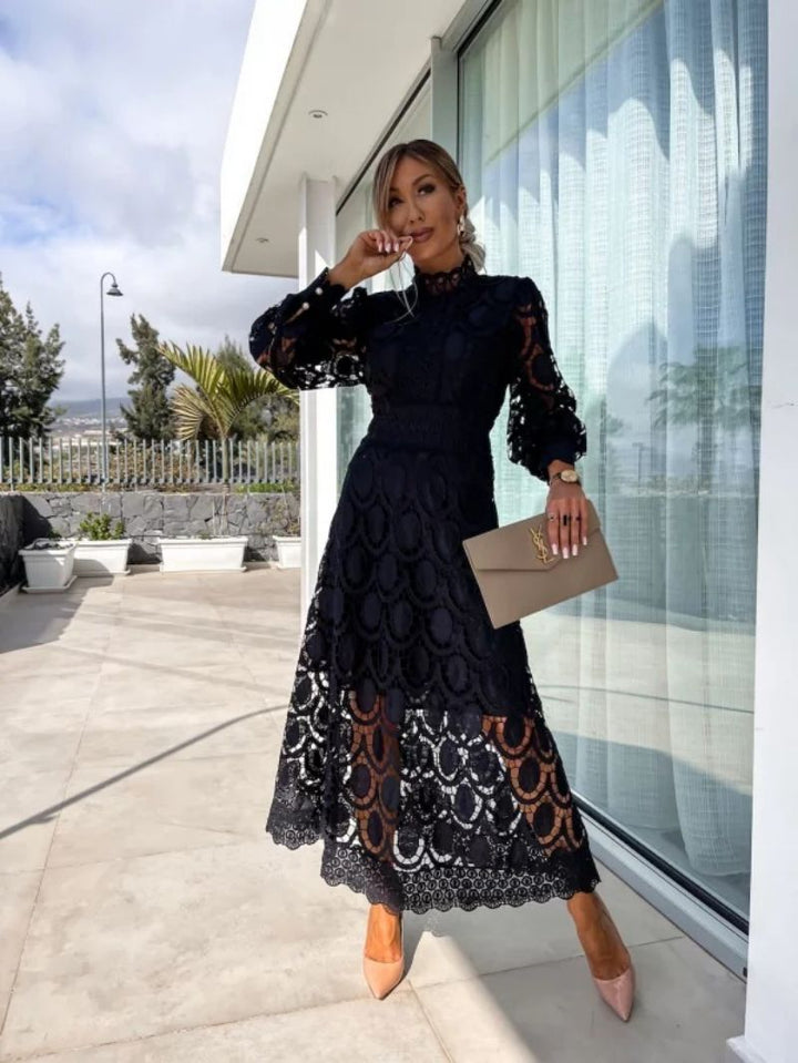 Formal women's midi dress featuring delicate lace & long sleeves, ideal for wedding guests & special occasions.