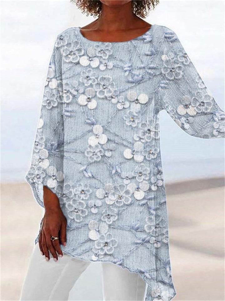 Relaxed fit women's tunic top, featuring beautiful floral embroidery & an elegant asymmetrical hem for autumn fashion.