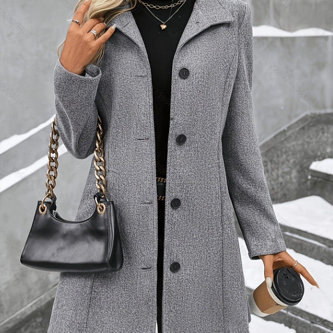 Sophisticated women's winter coat, single breasted, longline, featuring a classic notch collar.
