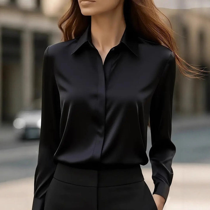 Close-up: luminous fabric & elegant buttons on this women's long sleeve professional blouse. Essential top.
