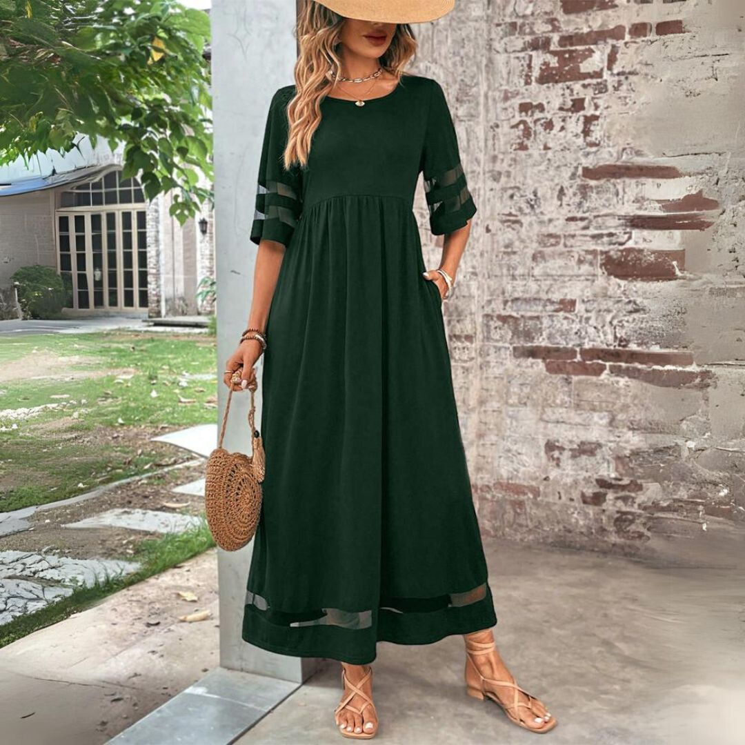 Chic women's maxi dress featuring elegant mesh panels & a flattering gathered waist for a stylish look.