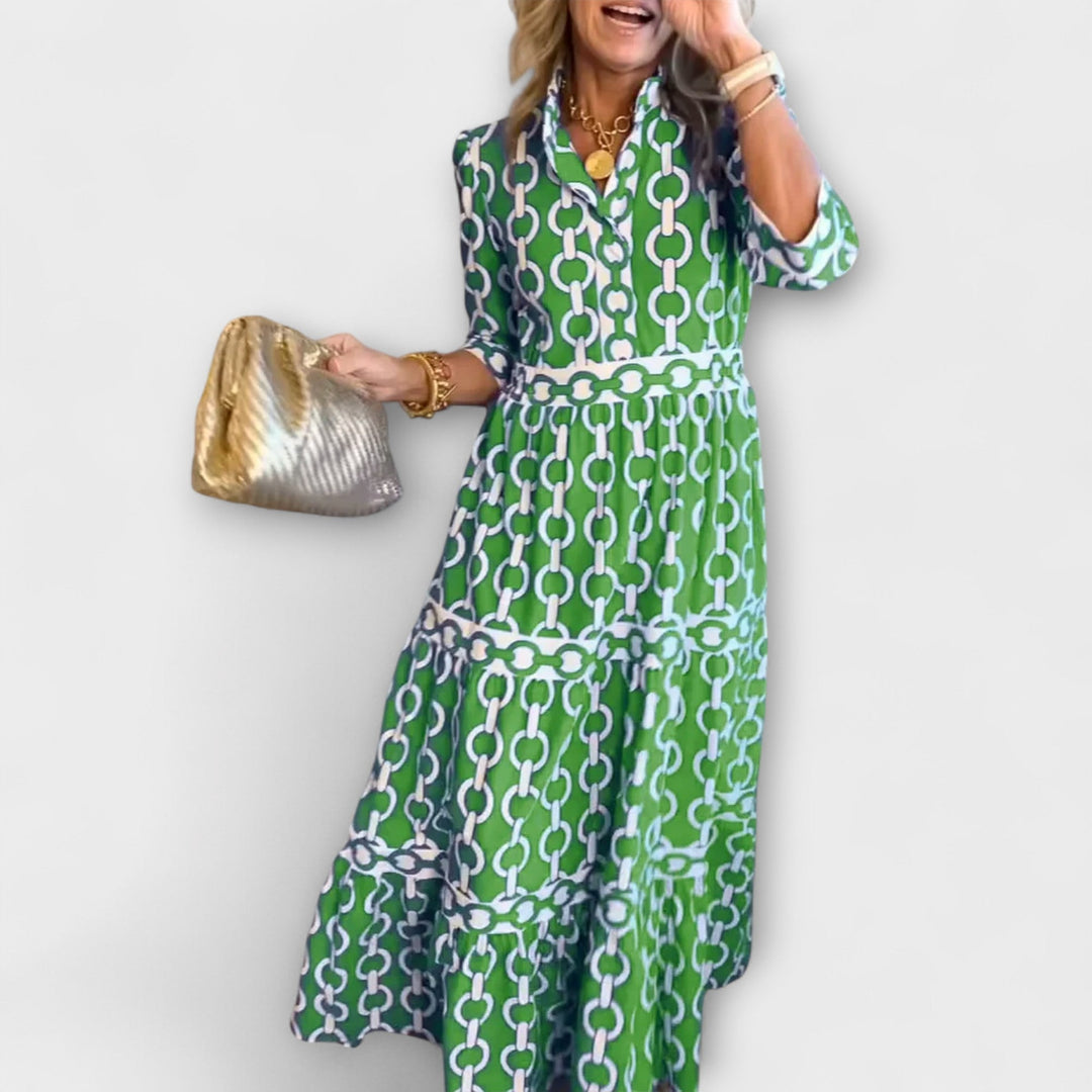 Blue women's elegant midi dress with a striking chain pattern, ideal for parties or casual wear.