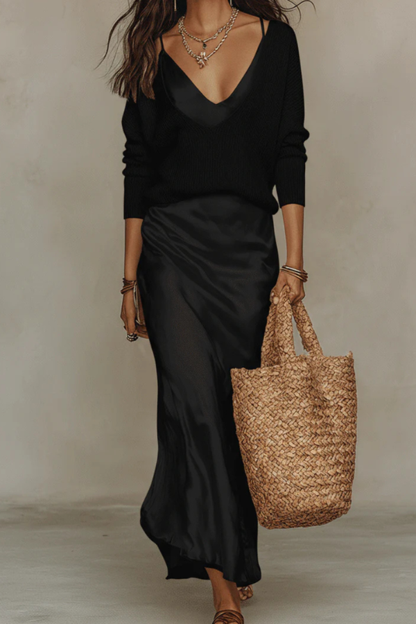Model wears elegant women's midi dress & sweater set, perfect for a stylish and comfortable day look.