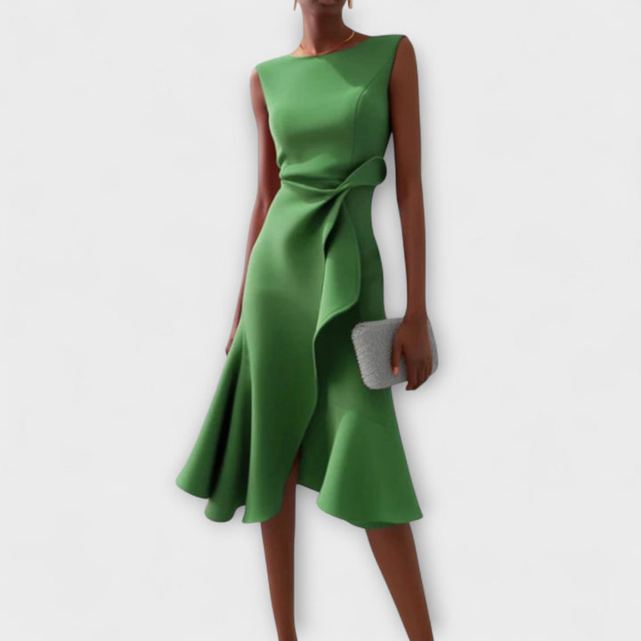 Casual yet elegant women's flared midi dress, featuring a ruffle hem, wrap detail, and round neck.