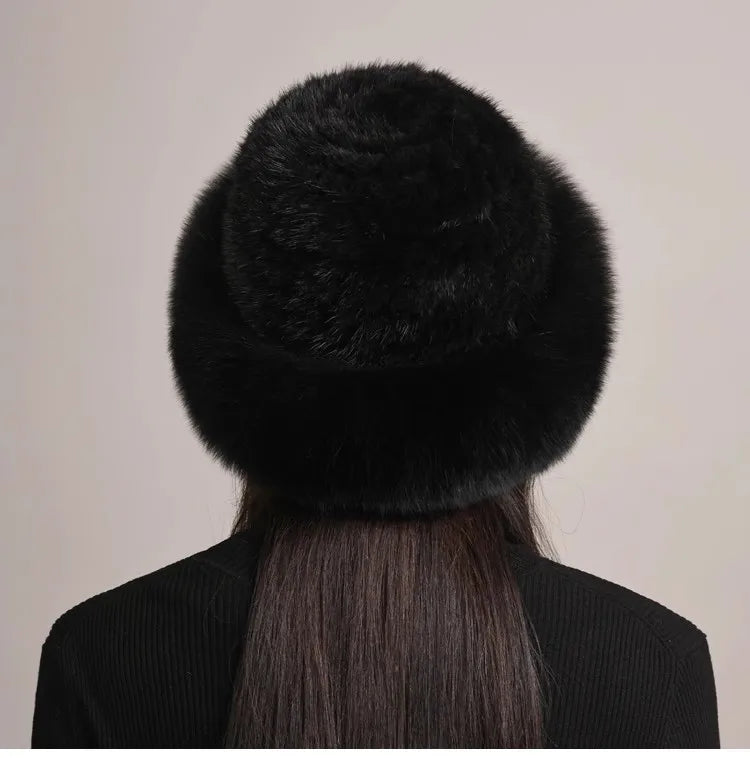 Overhead view of a beautiful women's mink and fox fur hat, showcasing its full design