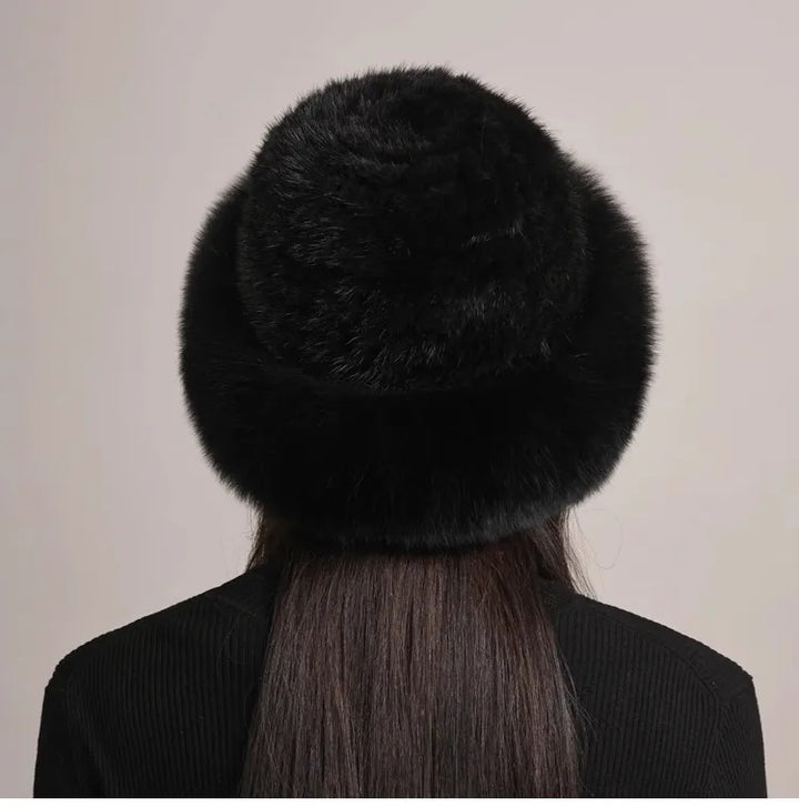 Overhead view of a beautiful women's mink and fox fur hat, showcasing its full design
