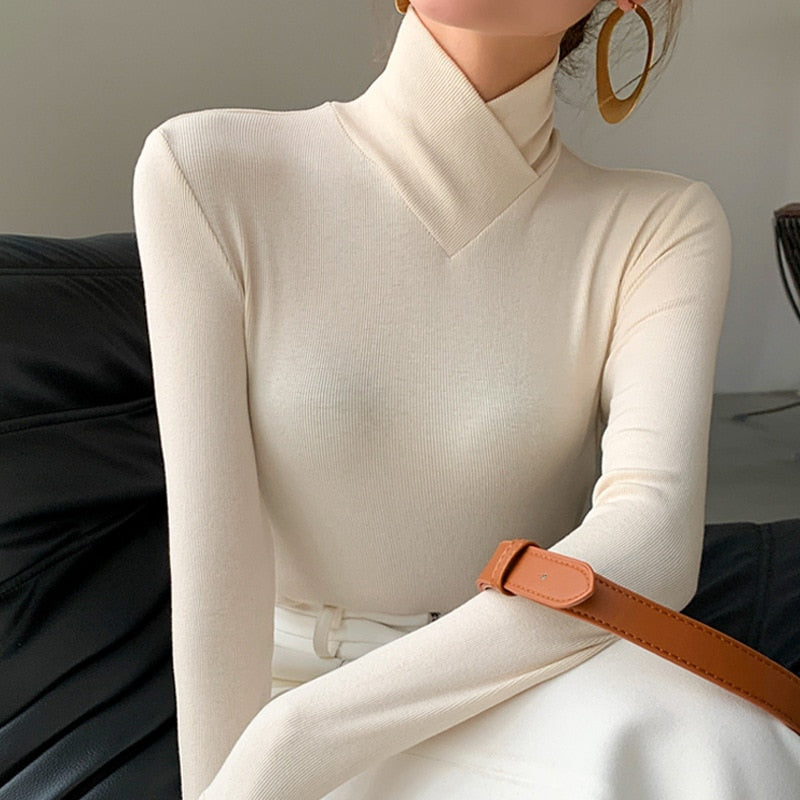 Elegant women's mock neck long sleeve top in a solid color, perfect for spring casual or dressy wear.