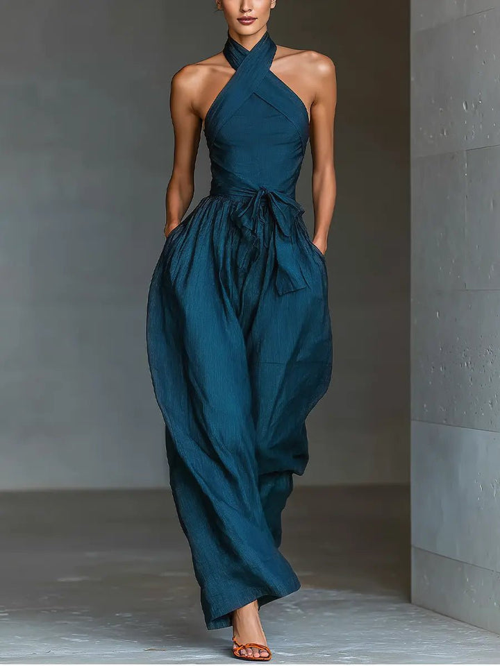 Elegant women's navy halter wide-leg jumpsuit. Perfect for formal wear, special occasions, or resort style.