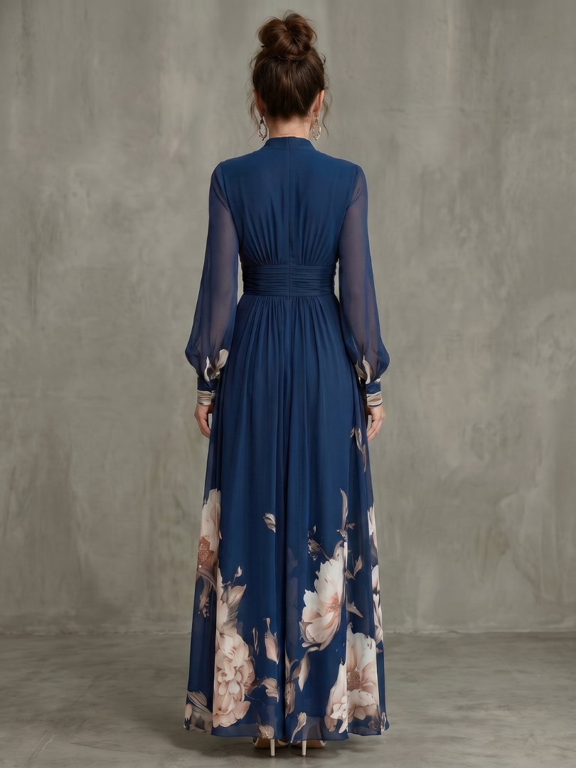 Women's navy V-neck pleated maxi dress with sheer long sleeves. Elegant, flowing, and perfect for parties.