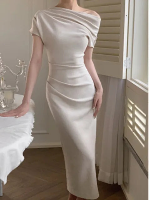 Elegant women's off-shoulder bodycon maxi dress, perfect for evening or party wear.