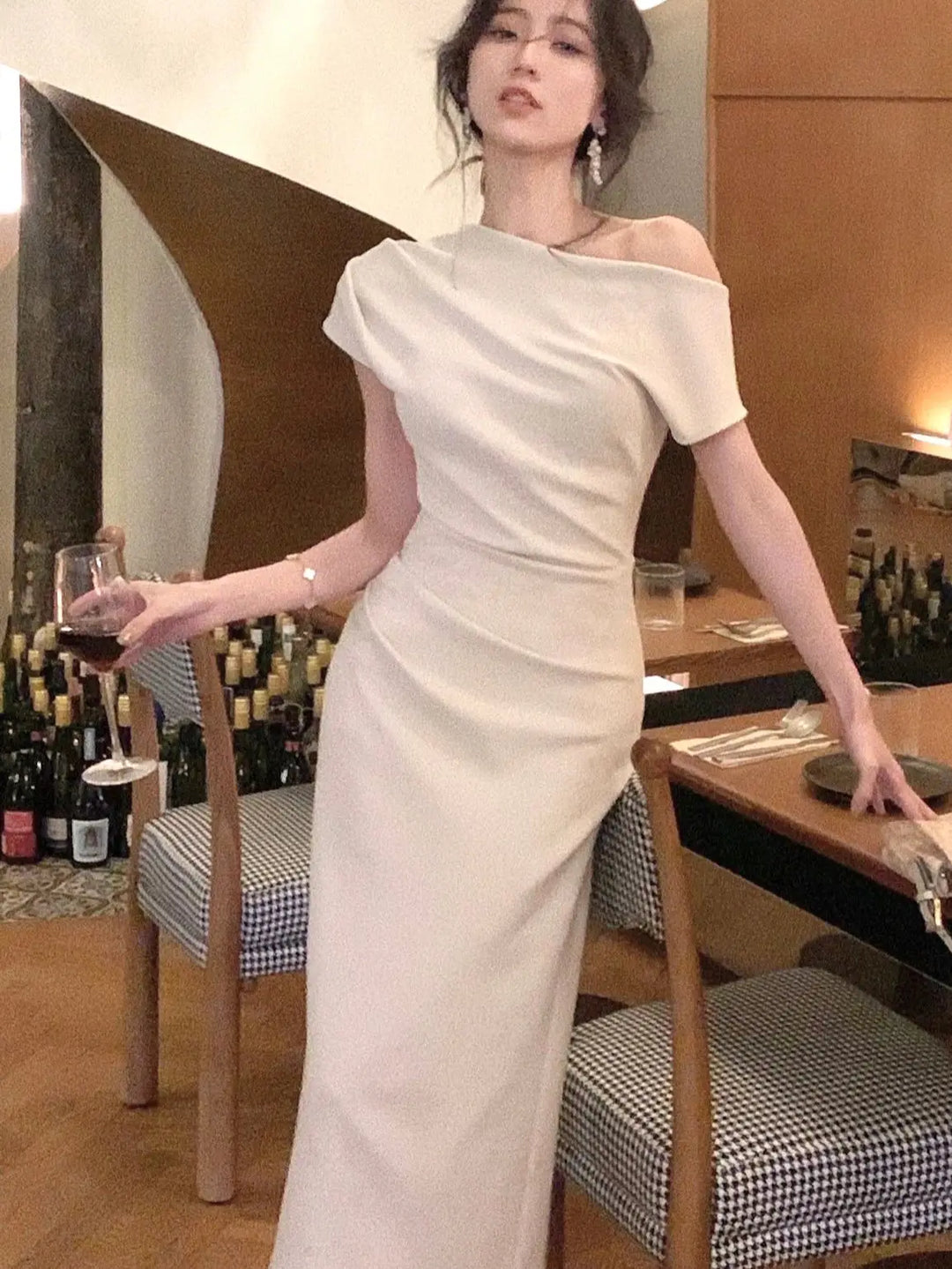 Chic women's off-shoulder bodycon maxi dress, comfortable for summer fashion and events.