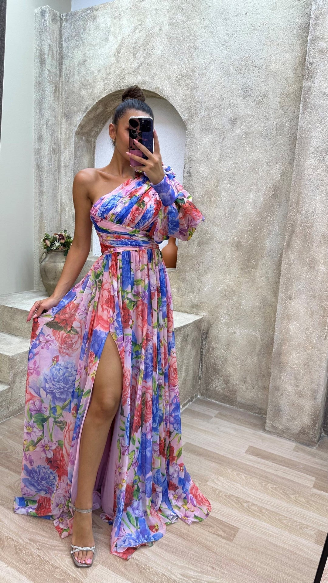 Vibrant floral print on a flowy one-shoulder maxi dress for women, featuring an elegant split hem.