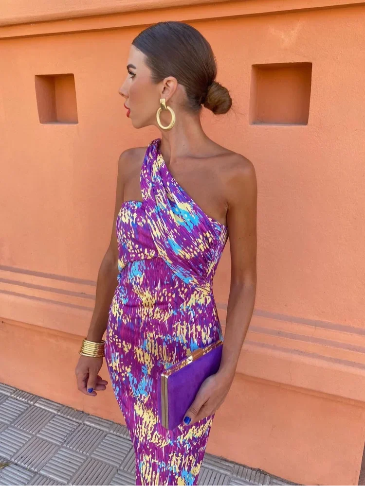Close-up of the geometric print on a women's one-shoulder maxi dress, highlighting its unique design.