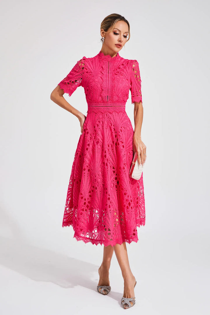 Close-up of the exquisite lace detail on a women's elegant white midi dress, chic apparel.