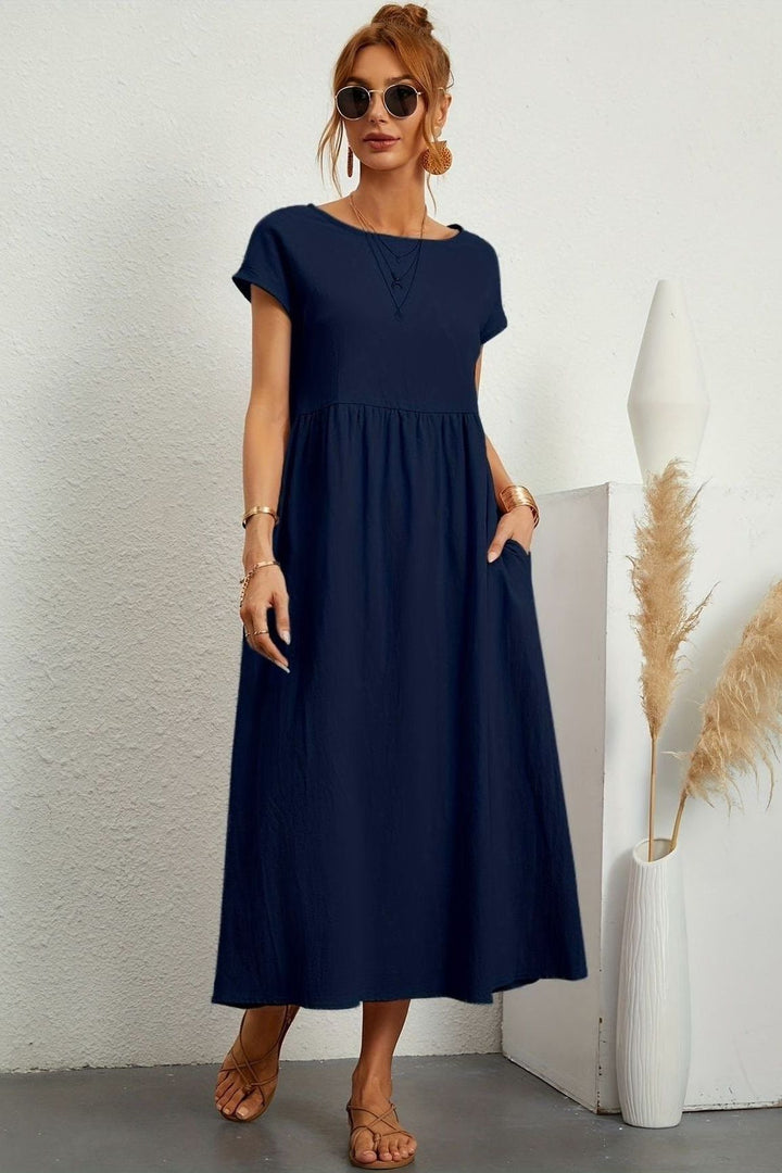 Timeless women's elegant pleated midi dress, versatile for any occasion, day or night.