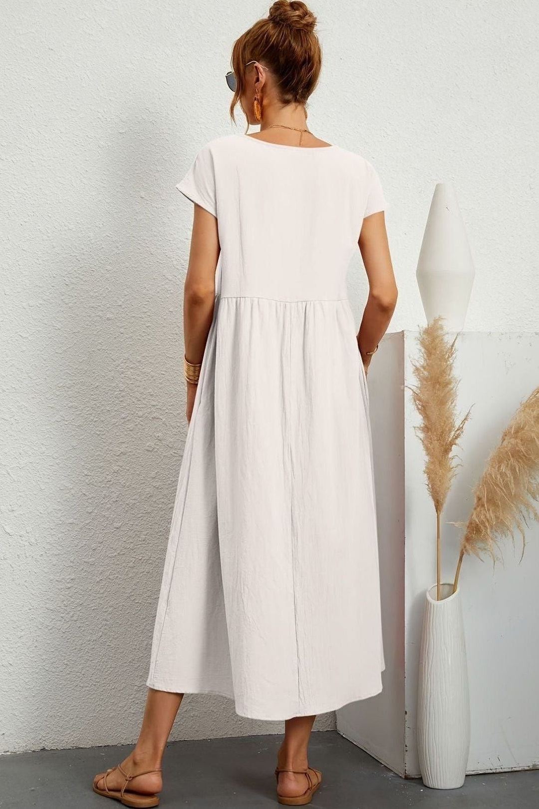 Pleated women's midi dress. Elegant and versatile for spring, summer, and special events.