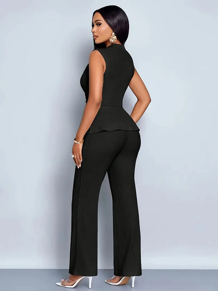 Two-piece women's outfit: pleated peplum top with matching pants, offering an elegant yet casual style.