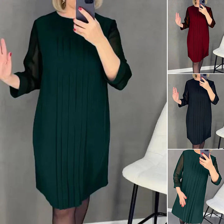Elegant women's pleated round neck midi dress in black, perfect for versatile styling