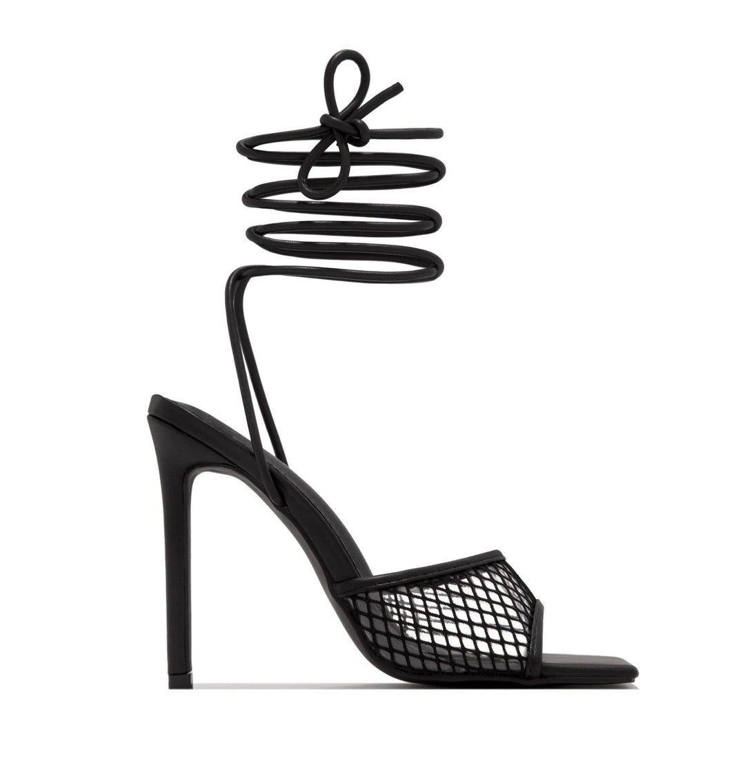 Stylish women's black lace pumps with a sharp pointed toe and comfortable block heel design.