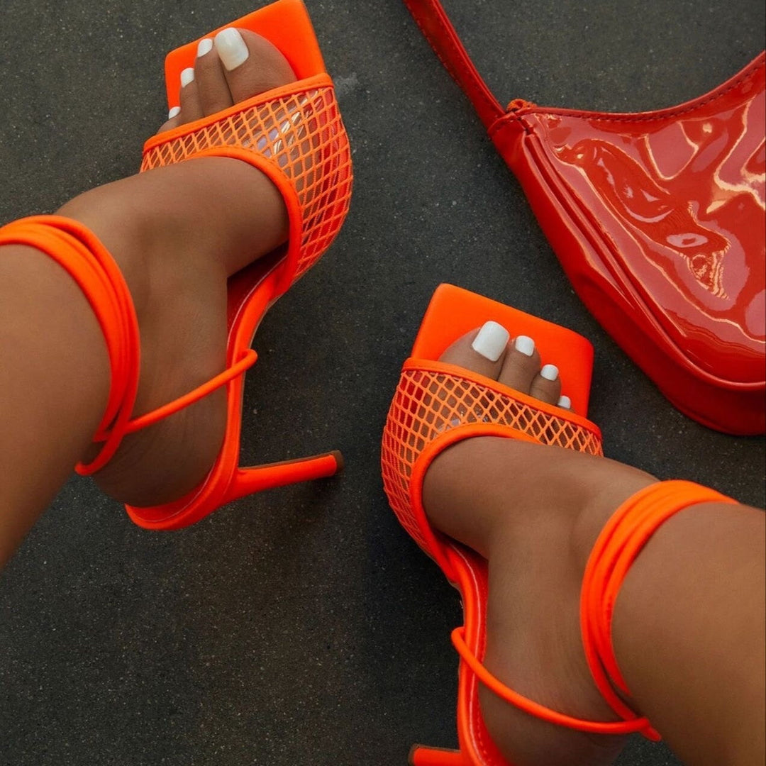 Premium women's elegant lace pumps with a pointed toe and comfortable block heel for sophisticated style.