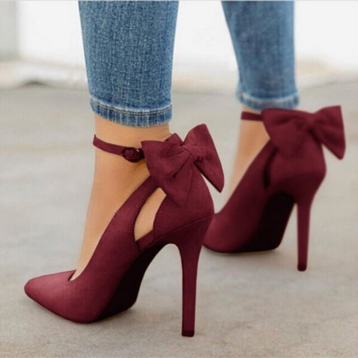 Stylish women's high heel dress shoes with a pointed toe and decorative bow, ideal for parties & evenings.