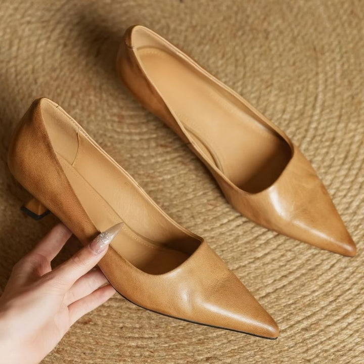Elegant women's pointed-toe pump with a thin heel, perfect for formal occasions & office wear.