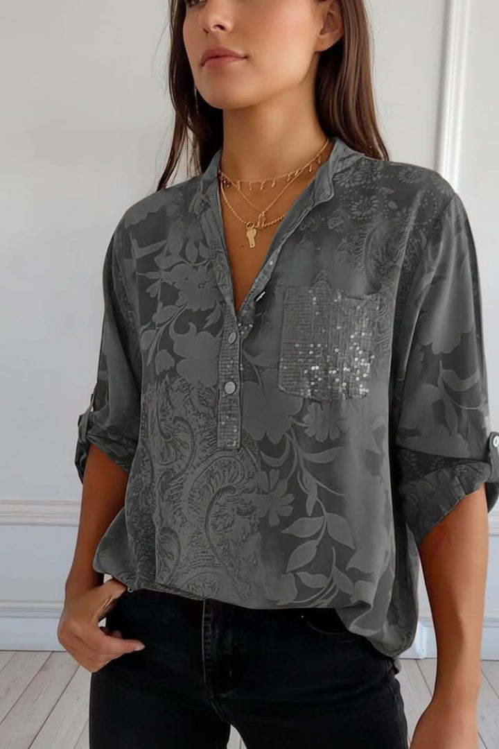 Sophisticated women's printed top, long sleeve, with a stylish front pocket. Elegant button blouse for any occasion.