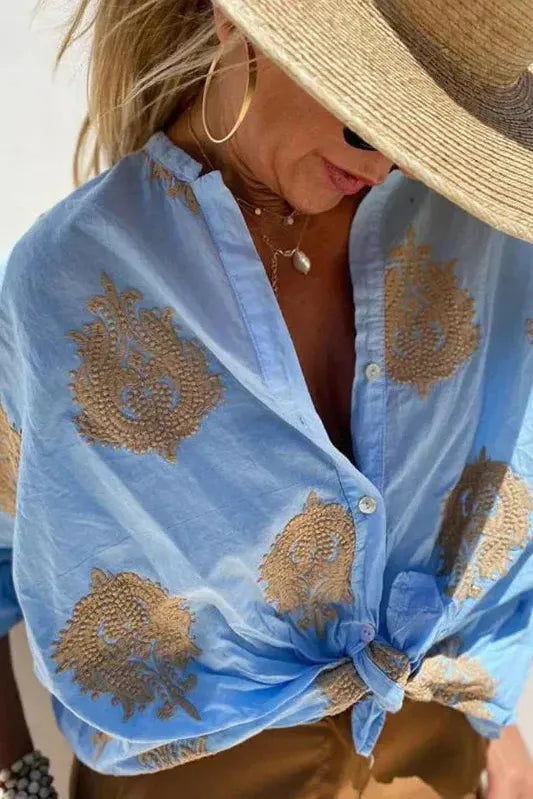 Chic women's printed blouse with unique pattern, ideal for effortless everyday wear and elegant fashion.