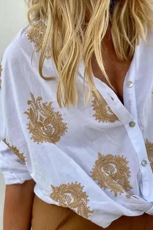 Stylish women's printed top featuring a long sleeve design, blending comfort with chic casual and office fashion.