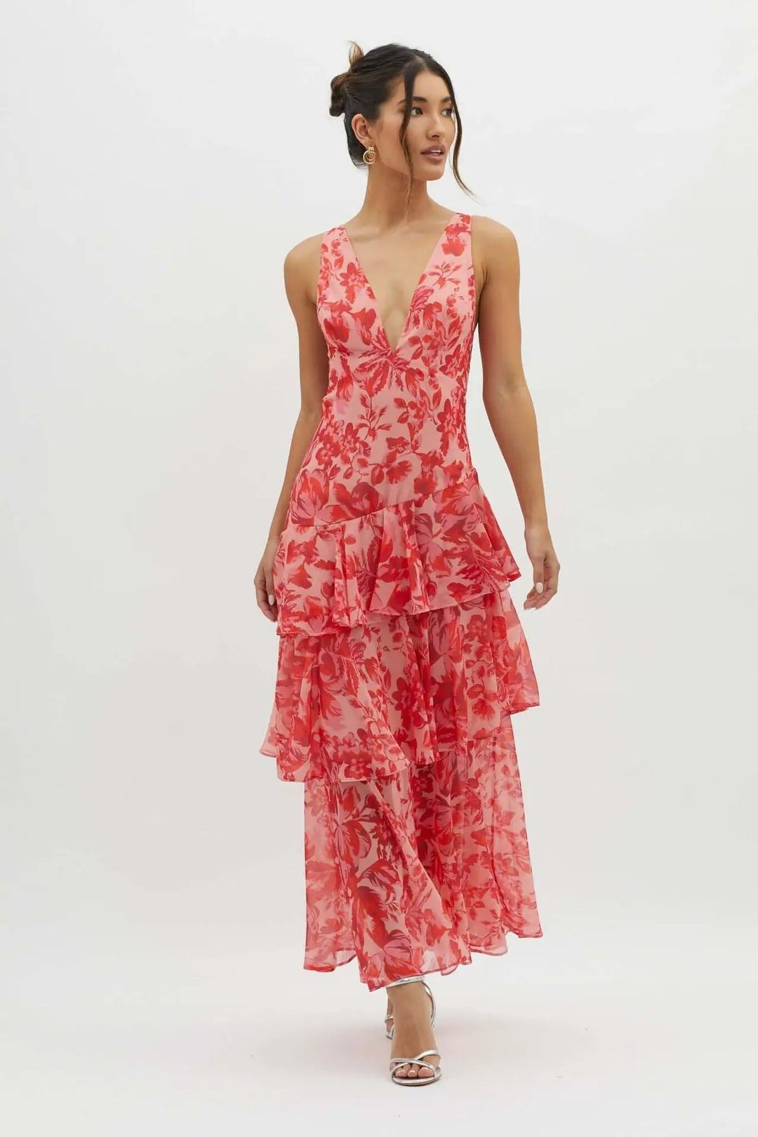 Beautiful printed V-neck maxi dress with tiered skirt and ruffle sleeves for elegant wedding guests.