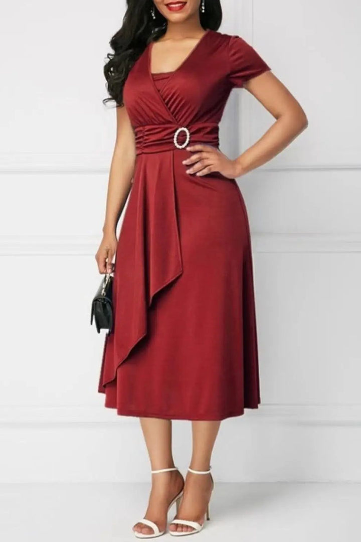 Elegant women's printed midi dress with a flattering silhouette, perfect for spring and summer events.