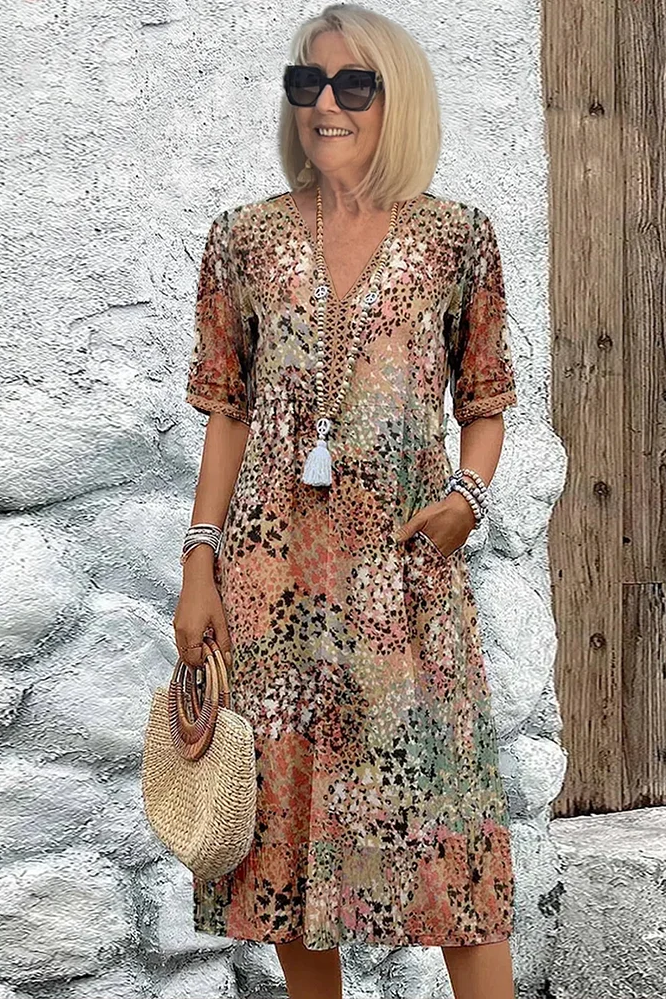 Elegant women's printed midi dress with flattering fit, perfect for spring & summer occasions.