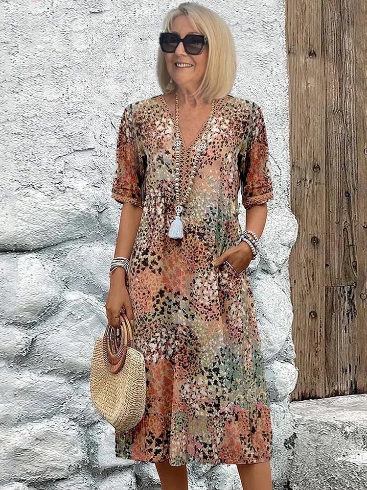 Elegant printed women's midi dress with V-neck, A-line silhouette, perfect for versatile summer styling.