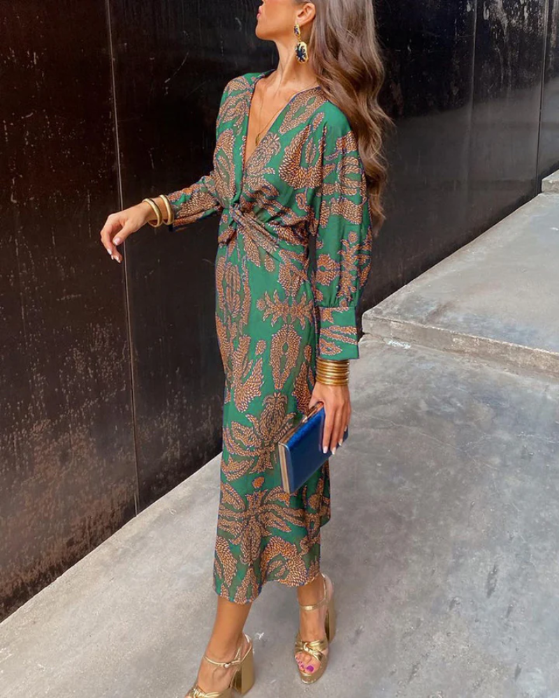 Women's elegant V-neck long sleeve party dress with an eye-catching print, ideal for celebrations.