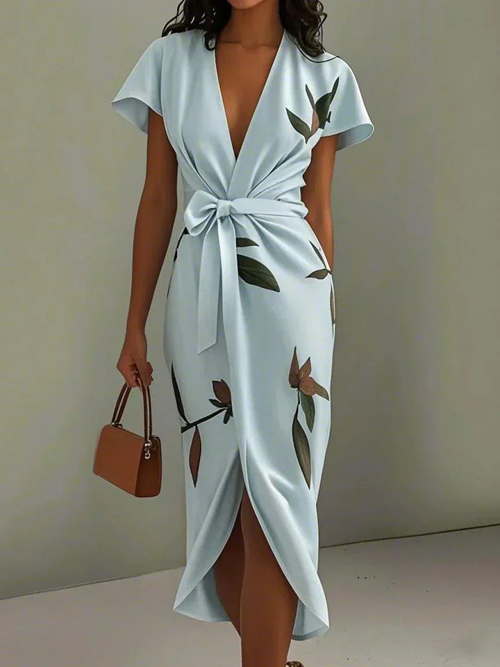 Stylish women's printed midi wrap dress with V-neck, flutter sleeves. Perfect elegant wedding guest or party dress.
