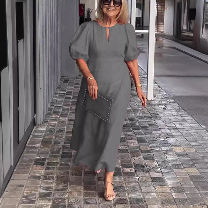 Sophisticated women's occasion wear midi dress, elegant puff sleeve A-line design for formal events.