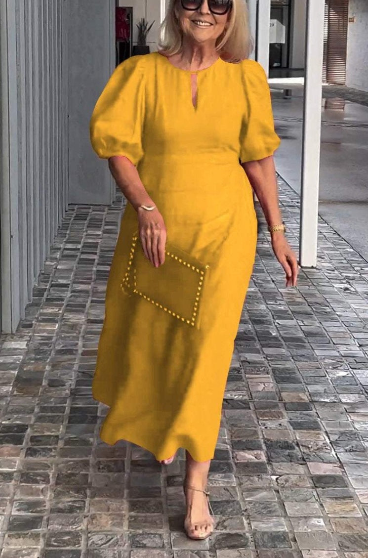 Flowing women's A-line midi dress with puff sleeves, a sophisticated wedding guest or party dress.