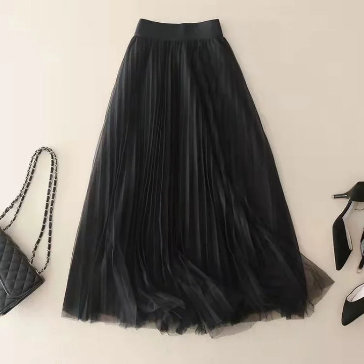 Purple pleated flowy midi skirt for women, elegant high-waist A-line design. Great for summer fashion.