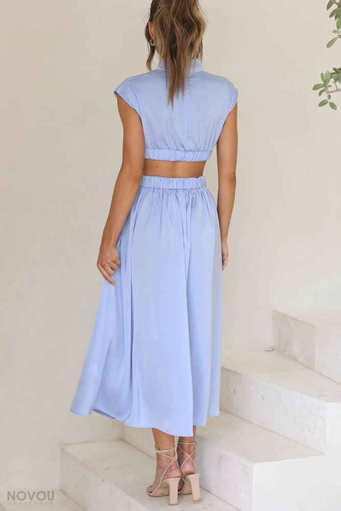 Model wearing Avelina elegant roll neck midi dress, waist cut-out. Perfect for parties.