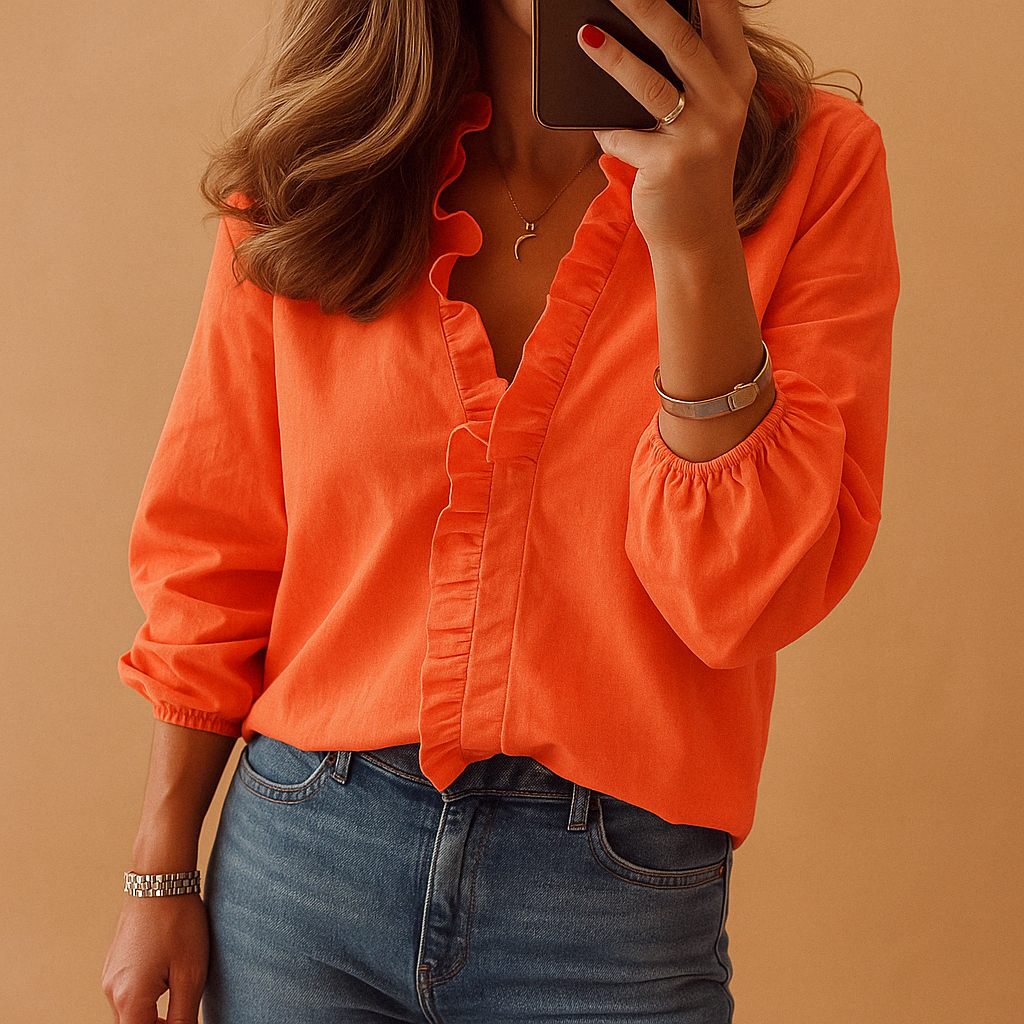 Elegant women's ruffle blouse, perfect for office wear or special occasions. Stylish long sleeve button-up top.