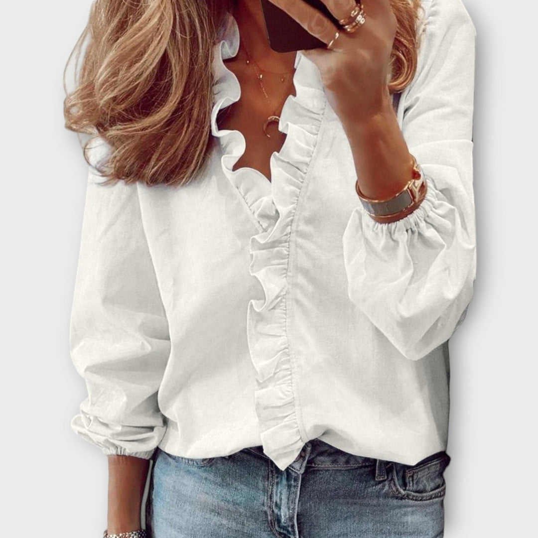 Elegant women's ruffled blouse, perfect for summer fashion, chic office wear or smart casual style.